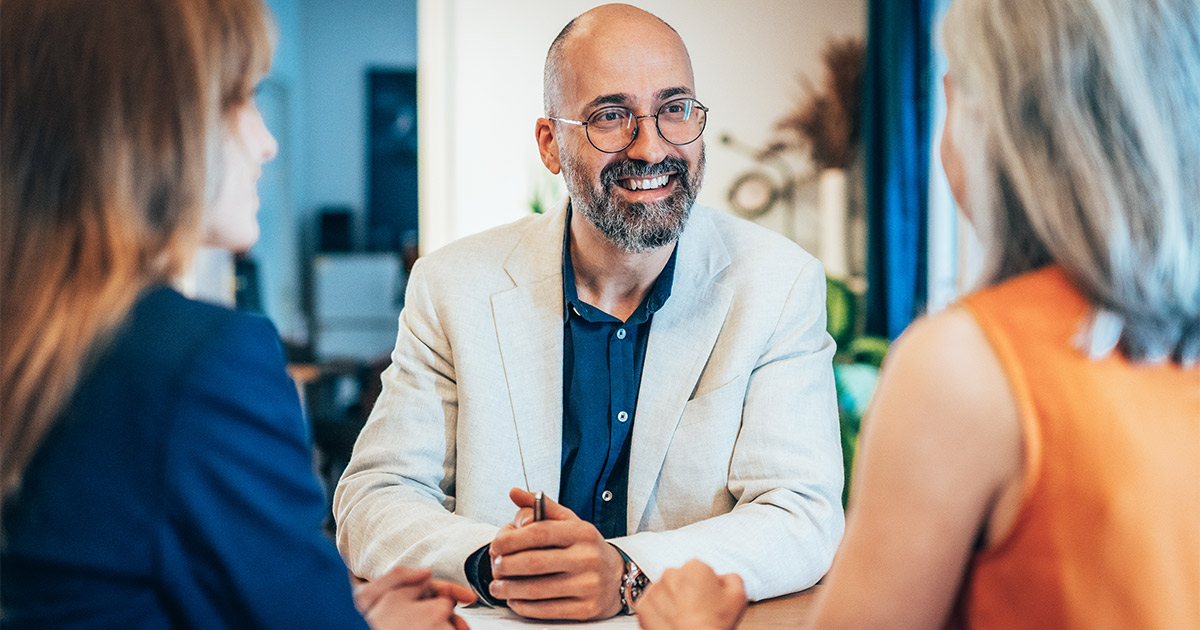 A mortgage banker speaks with two women about resources and community-based support for their long distance move.